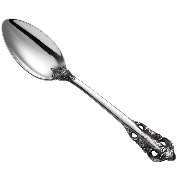 A Reserve by Libbey stainless steel teaspoon with an ornate handle.