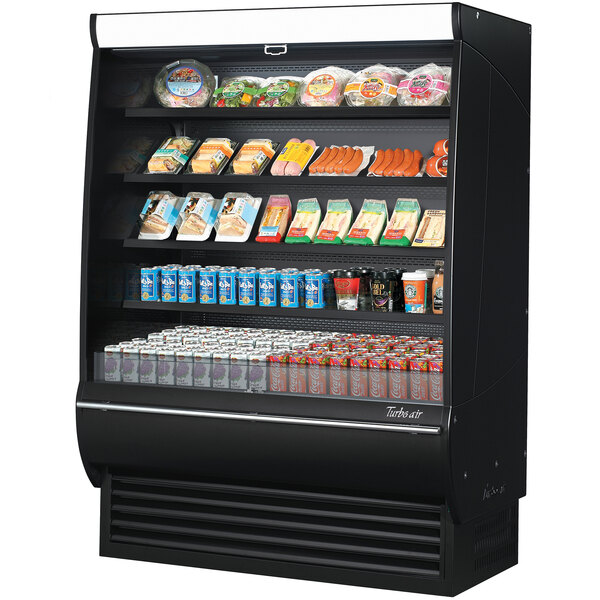 A Turbo Air black refrigerated air curtain merchandiser with different types of food on shelves.