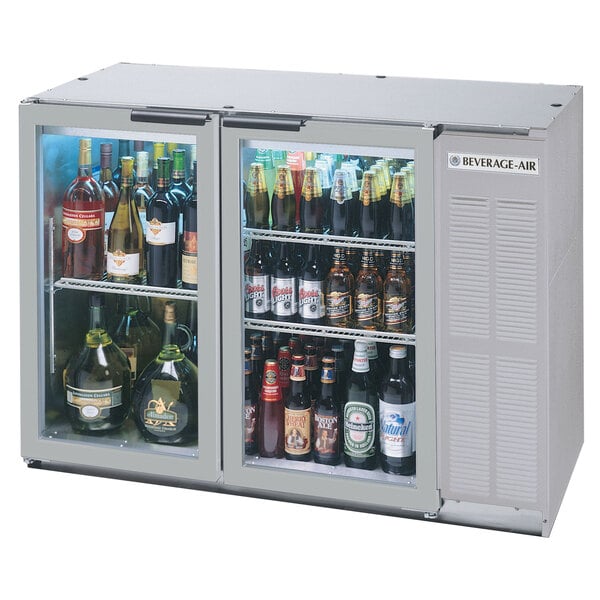 A Beverage-Air back bar refrigerator with glass doors filled with beer bottles.