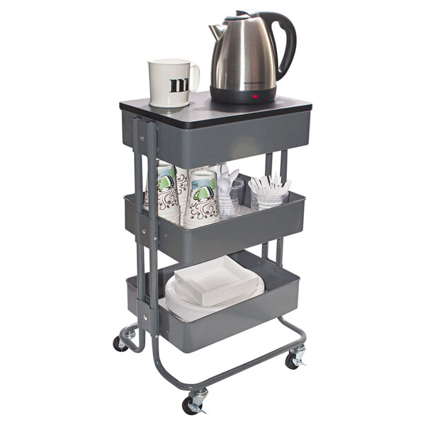 A gray Vertiflex multi-use storage cart with a kettle and white mugs on top.