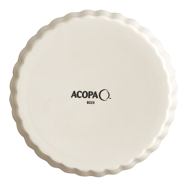 A round, vanilla bean-colored stoneware souffle or creme brulee dish with a fluted edge and the Acopa brand name on the bottom.