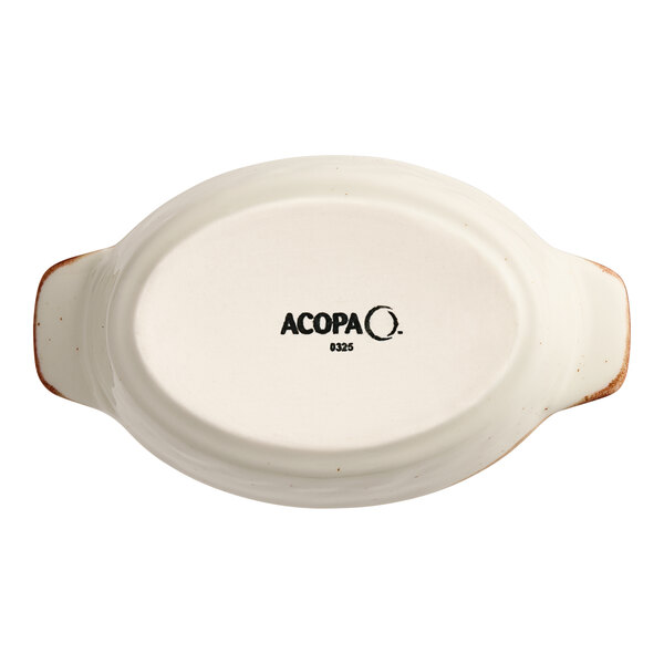 A small oval porcelain rarebit dish with handles, shown from the bottom and labeled 'Acopa'.