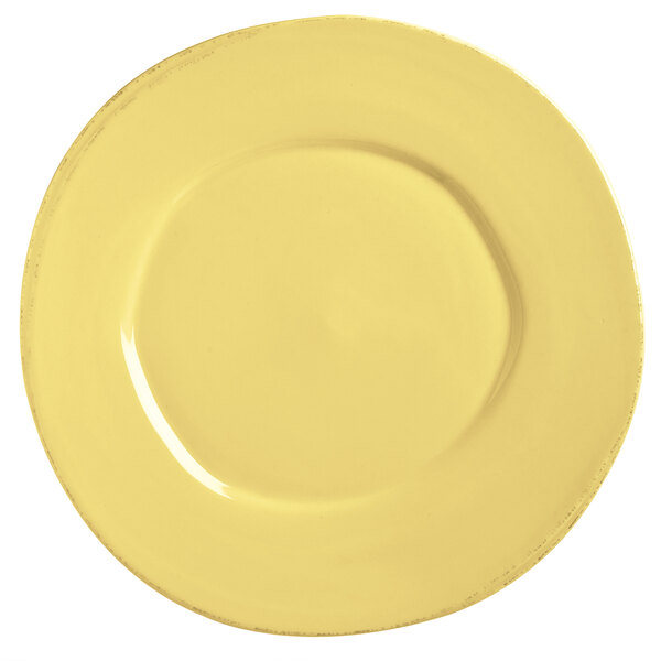 A Libbey Farmhouse yellow porcelain plate with a white rim.