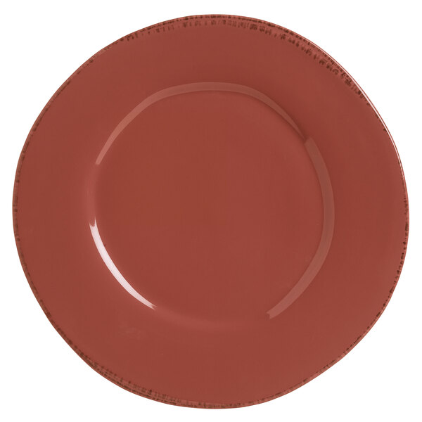 A red Libbey porcelain plate with a speckled rim.