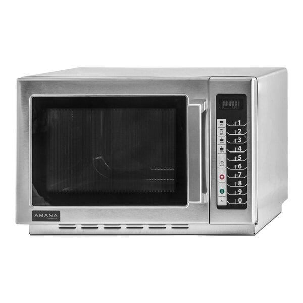 An Amana stainless steel commercial microwave with a glass door.