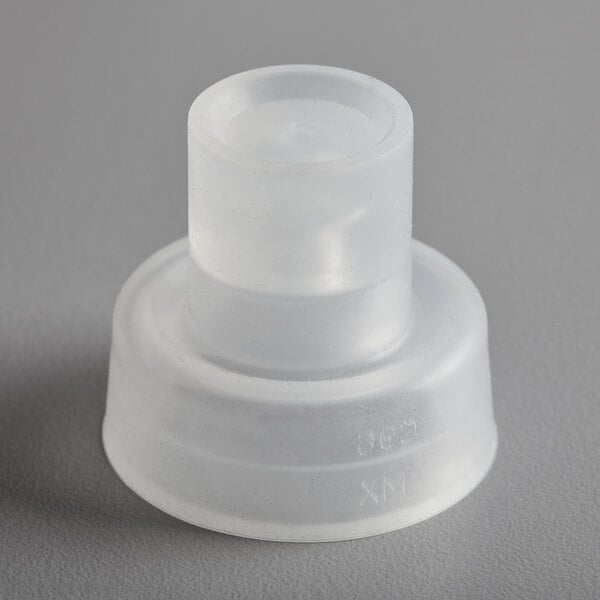 A white plastic round top for a Cambro container.
