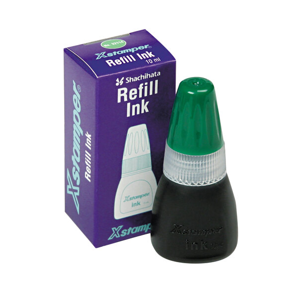 A green and white Xstamper refill ink bottle with a black cap.