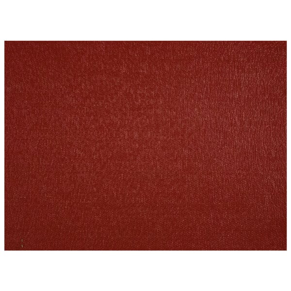A red rectangular vinyl placemat with a pattern.