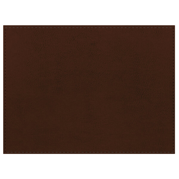 A close-up of a brown leather rectangular placemat with a customizable black border.