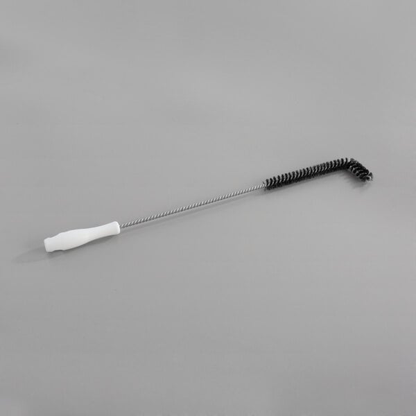 A black and white Carlisle brush with a silver metal rod and round metal tip.