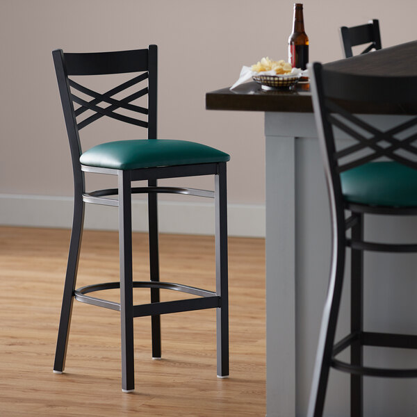 Lancaster Table & Seating Black Finish Cross Back Bar Stool with 2 1/2" Green Vinyl Padded Seat