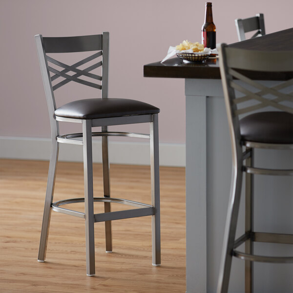 Lancaster Table & Seating Clear Coat Steel Cross Back Bar Height Chair with 2 1/2" Dark Brown Vinyl Seat - Preassembled