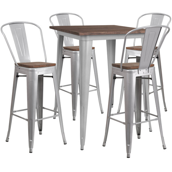 A Flash Furniture rustic galvanized steel and wood bar height table with four barstools.