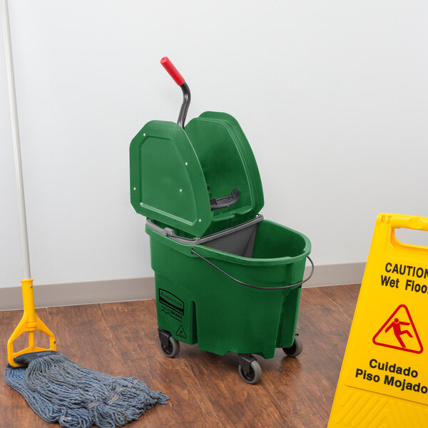 A Rubbermaid green mop bucket with a gray dirty water bucket.