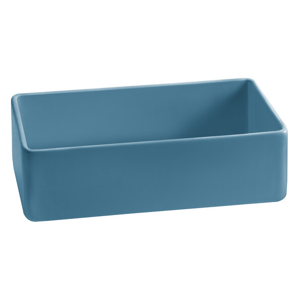 A Tablecraft blue rectangular cast aluminum bowl on a table.