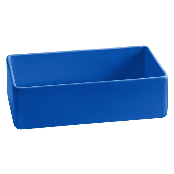 A cobalt blue rectangular cast aluminum bowl with straight sides.