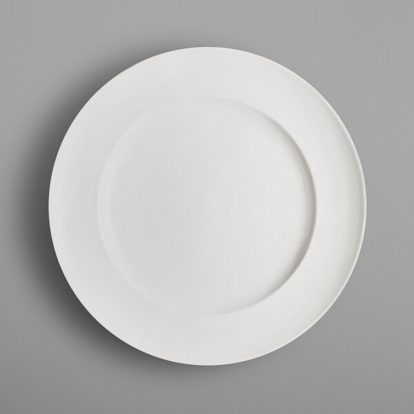 A RAK Porcelain ivory porcelain plate with a circular edge on a white background.