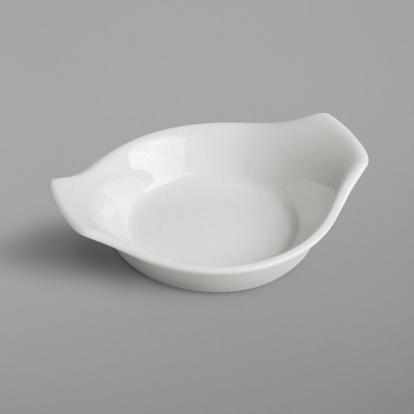 A white RAK Porcelain continental sauce dish with a handle.