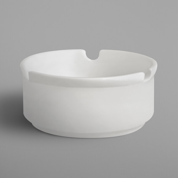 A white RAK Porcelain ashtray with a hole in the middle.