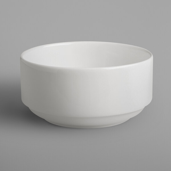 A RAK Porcelain ivory bowl on a gray background.