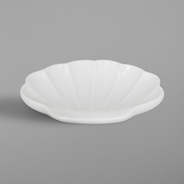 A white bowl with a shell pattern.