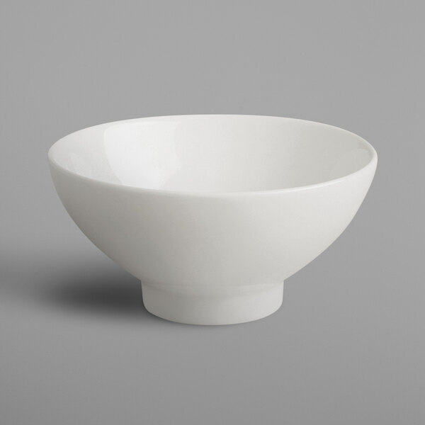 A RAK Porcelain ivory porcelain bowl on a gray background.