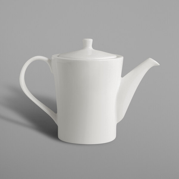A white coffee pot with a lid and a handle.