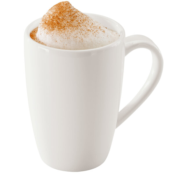A white RAK Porcelain mug with a foamy drink in it.