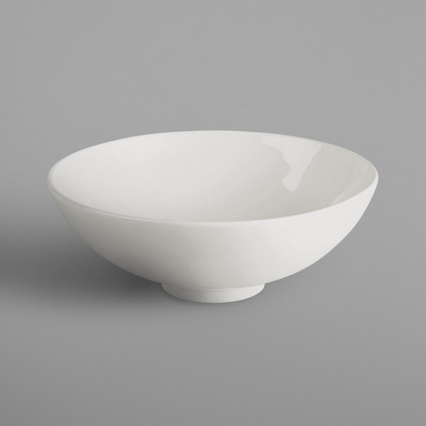 A white RAK Porcelain salad bowl on a gray background.