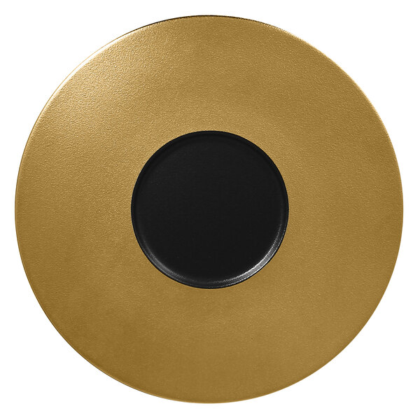 A gold plate with a black circle in the center.