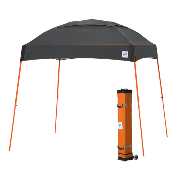 A black tent with orange poles and accents.