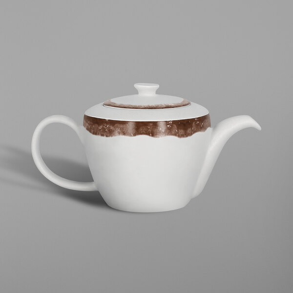 A white porcelain teapot with oak brown trim.