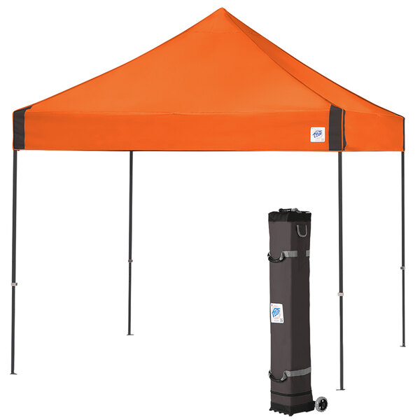 An orange E-Z Up canopy with a black bag on the side.