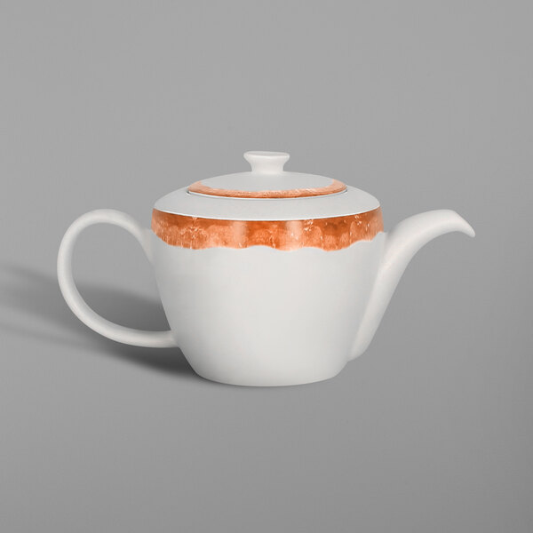 A white porcelain teapot with orange trim.