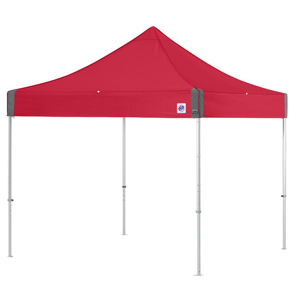 A red E-Z Up canopy with clear aluminum poles.