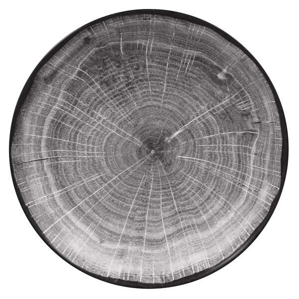 A RAK Porcelain beech grey porcelain deep coupe plate with a tree stump design.