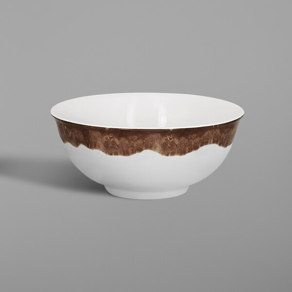 A white bowl with brown stripes on the rim.