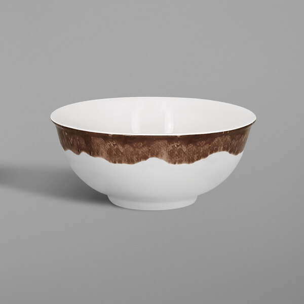 A white RAK Porcelain bowl with brown woodgrain trim.