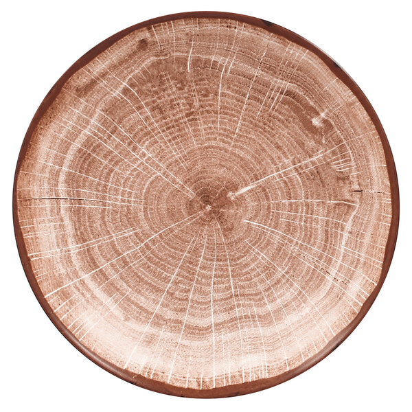 A circular porcelain plate with a walnut brown center and white band with a wood grain design.