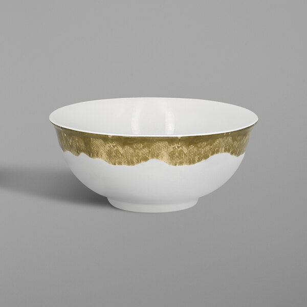 A white bowl with a moss green interior and white exterior.