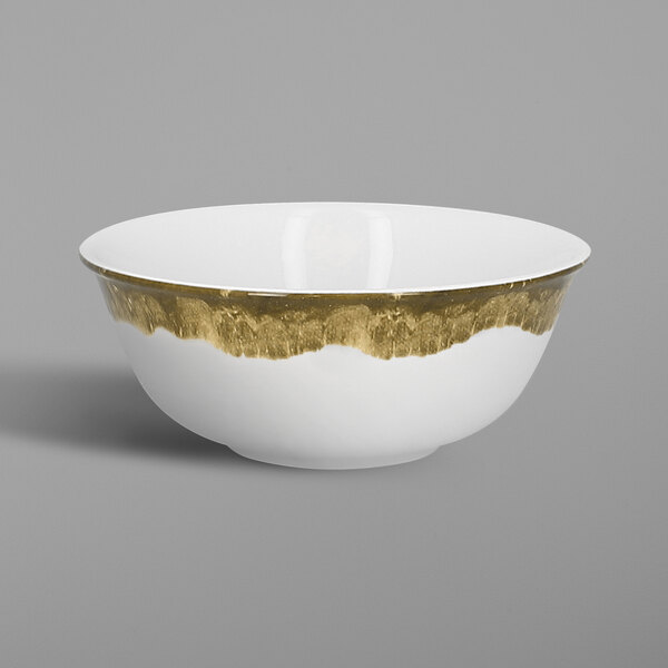 A white RAK Porcelain bowl with gold trim.