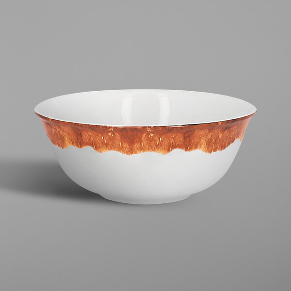A white RAK Porcelain bowl with brown and orange cedar design.