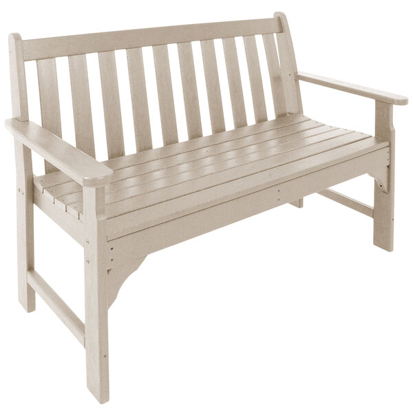 A Sand POLYWOOD Vineyard bench with armrests.