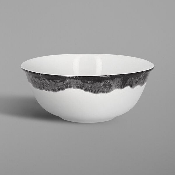 A white RAK Porcelain bowl with black trim.