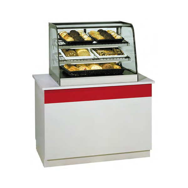 A Federal Industries countertop bakery display case with food displayed inside.