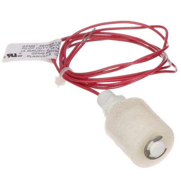 A white plastic cylinder with a red and white wire and label.