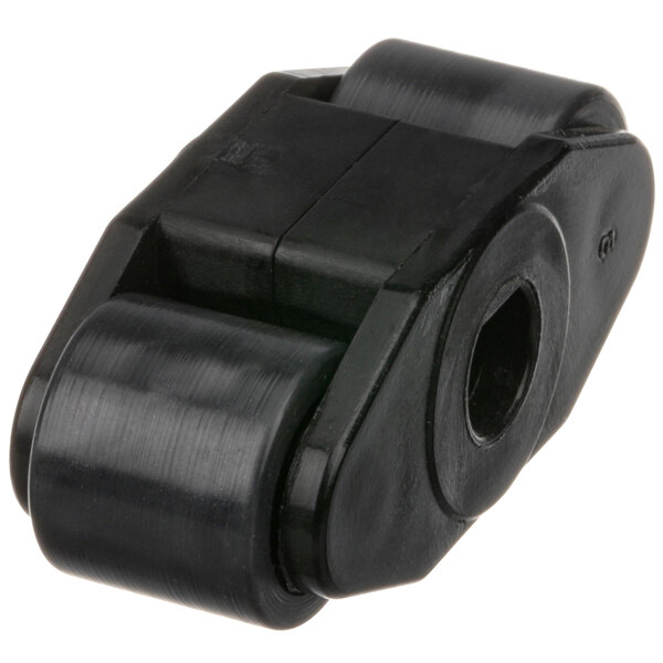 A close-up of a black plastic Jackson roller with a hole.
