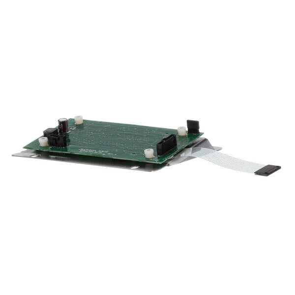 A green circuit board with a white strip and a small electronic board.