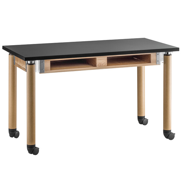 A black and wood National Public Seating science lab table with wheels.