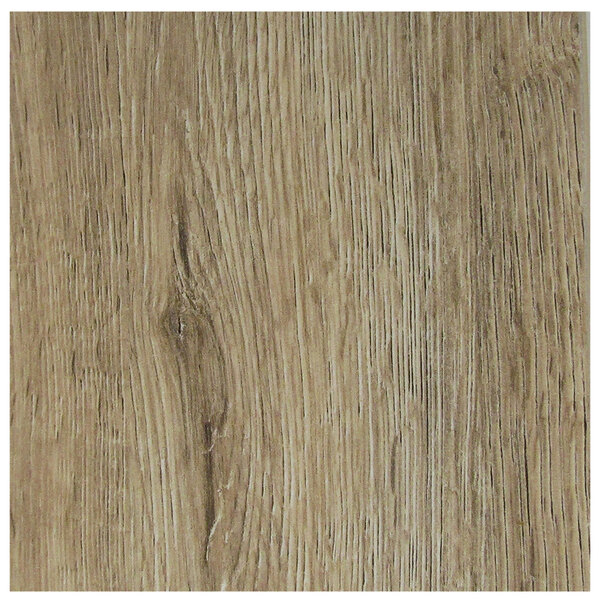 A close-up of a Grosfillex light oak wood grained table top.